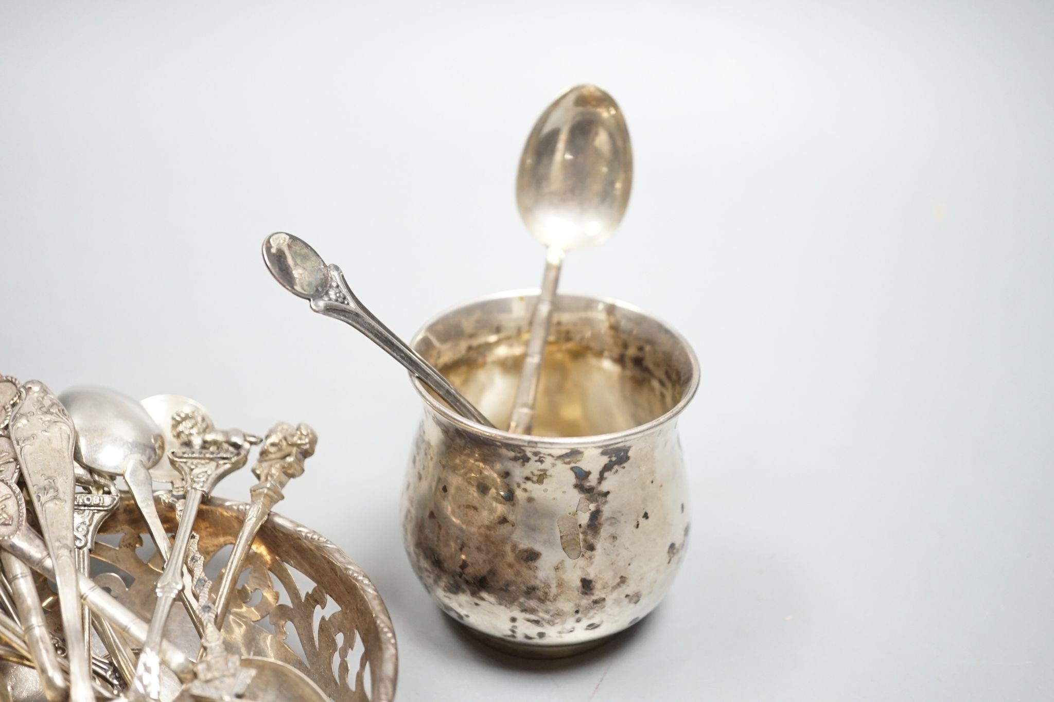 A Chinese white metal overlaid glass dimpled decanter and stopper, 19.1cm, a 900 small vase, a pierced silver bowl and a group of assorted Chinese and other white metal spoons.